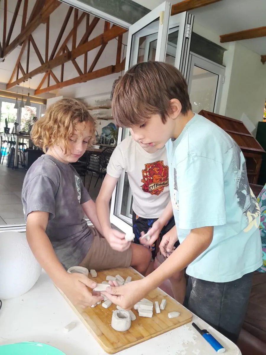 Children exploring together at a table